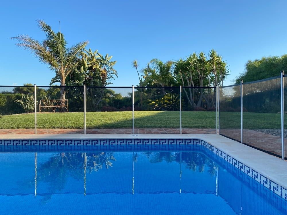 A Large Swimming Pool With a Fence Around It — Affinity Swim in Norman Gardens, NSW
