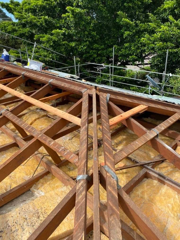 A Wooden Structure is Being Built on Top of a Roof — Northern Plumbing In Mount Louisa, QLD
