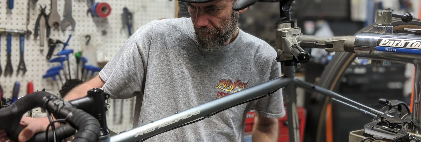 Eric's brother, Scott, working on a bicycle repair at Skinny Wheels Bike Shop