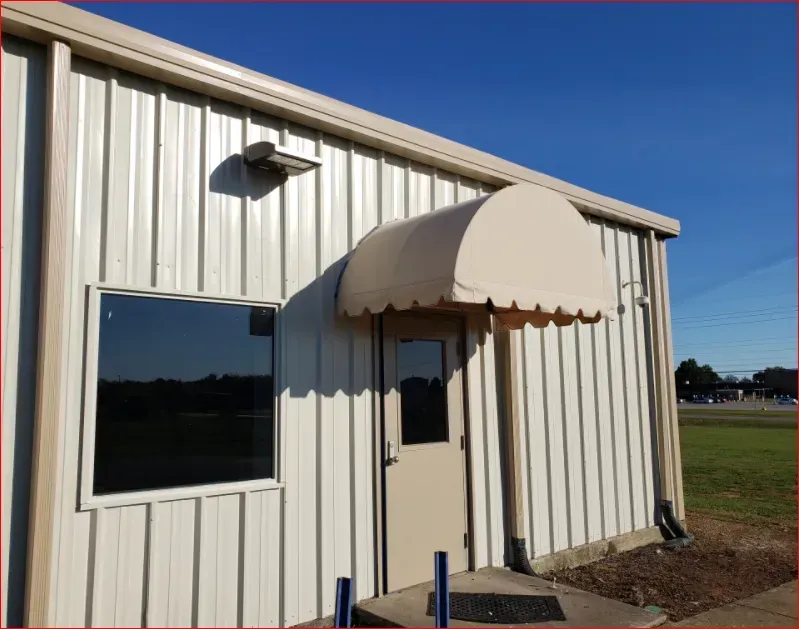 White Building with Tann Half Barrel Awning — Decatur, AL — Evans Awnings
