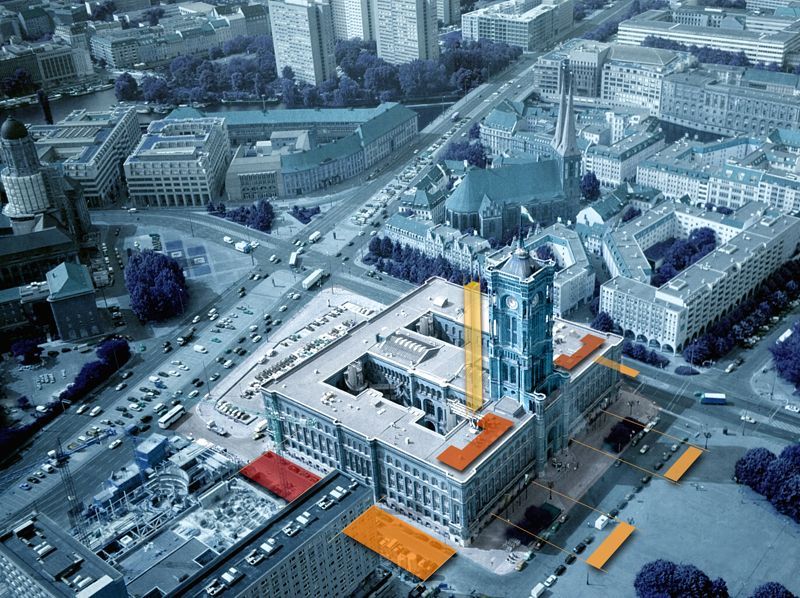 Eine Luftaufnahme einer Stadt mit einem großen Gebäude in der Mitte