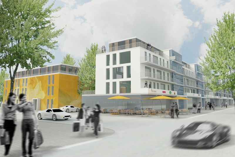 Ein Auto fährt eine Straße vor einem Gebäude entlang.