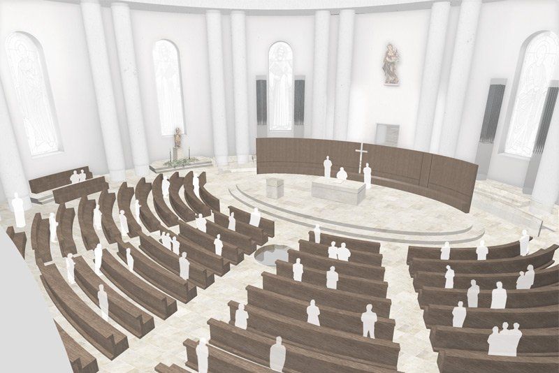 Eine Luftaufnahme einer Kirche mit Menschen, die in den Kirchenbänken sitzen