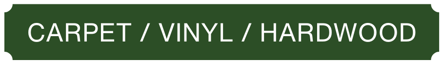 A green sign that says carpet / vinyl / hardwood
