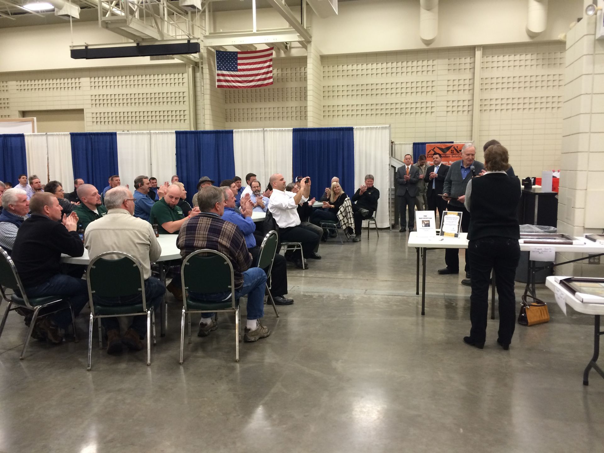 A woman is giving a presentation to a group of people