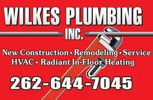 A red sign for wilkes plumbing inc.