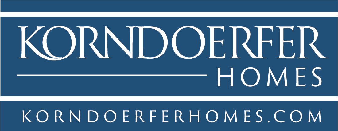 A blue and white logo for korndoerfer homes