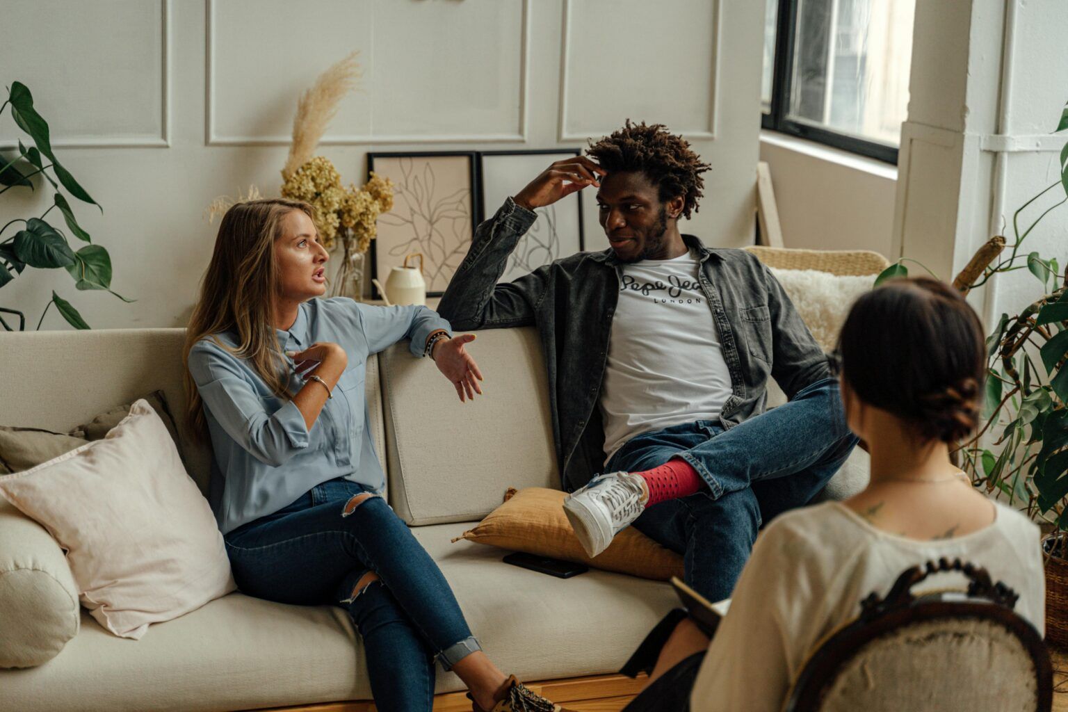 A couple in a Houston therapy session with their therapist, ketamine-assisted couples therapy