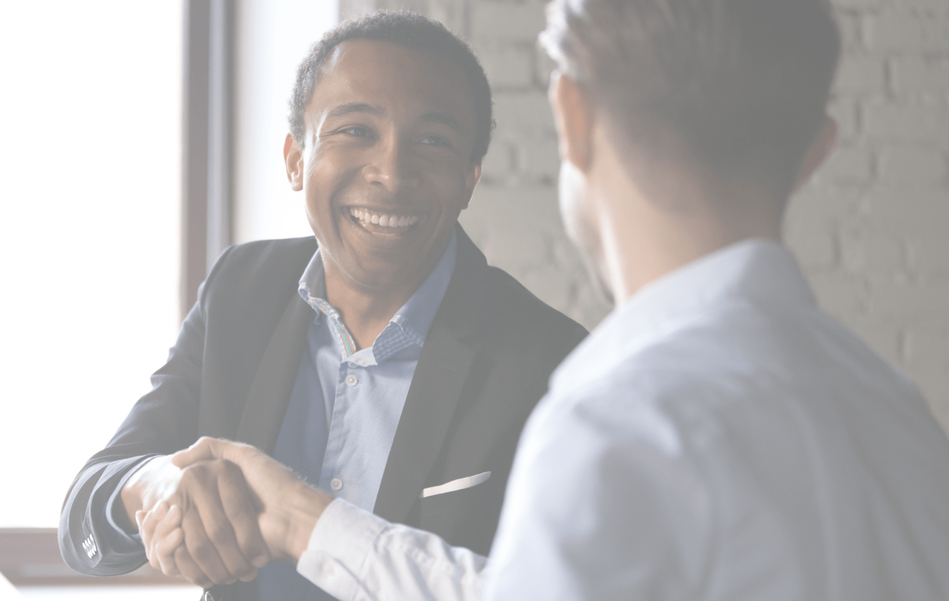 Two business men shaking hands