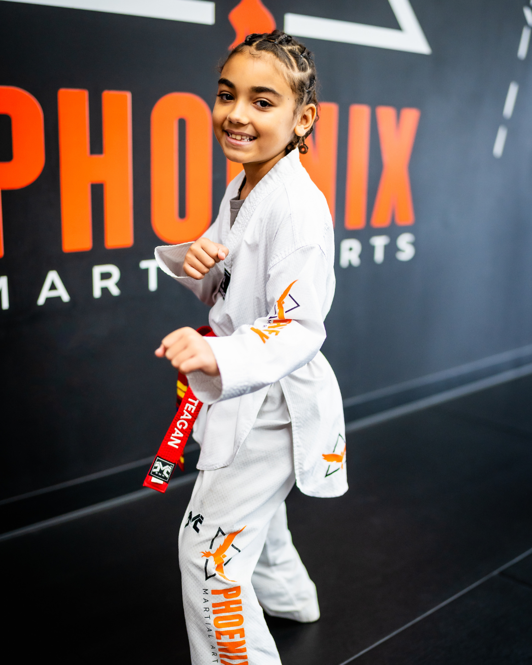 Teagan today as a confident martial arts student and competitor