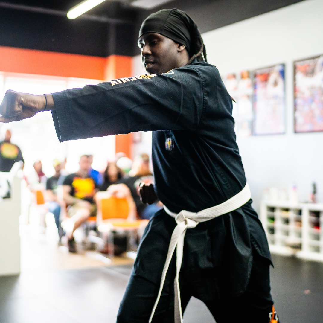 Adult martial arts student practicing a straight punch during Taekwondo class at Phoenix Martial Arts in Murfreesboro, TN