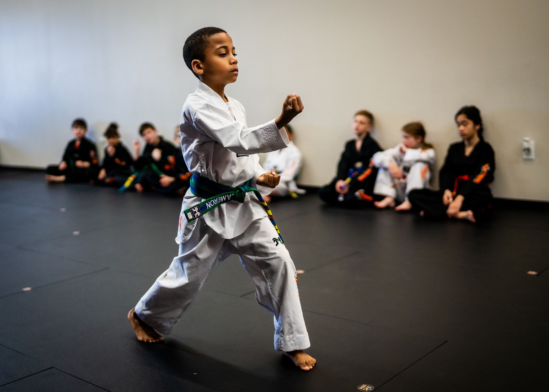 Young student practicing back fist technique during kids martial arts class at Phoenix Martial Arts in Murfreesboro, TN