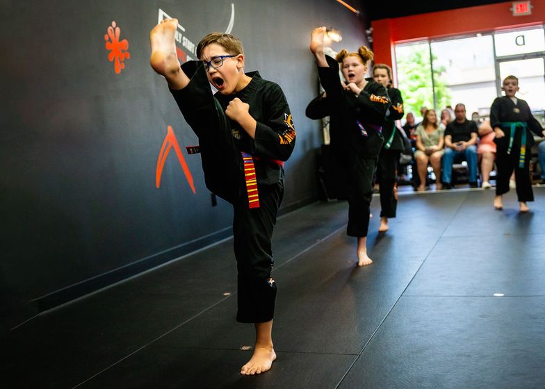 Kids kicking targets at Tennessee Taekwondo
