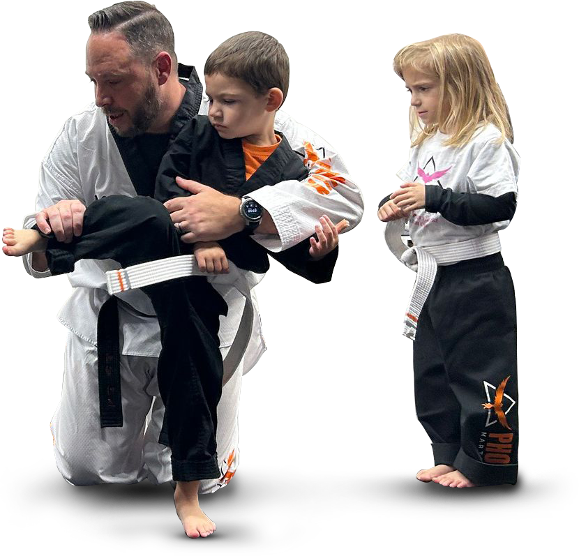Instructor helping children build confidence through kids martial arts at Phoenix Martial Arts in Murfreesboro