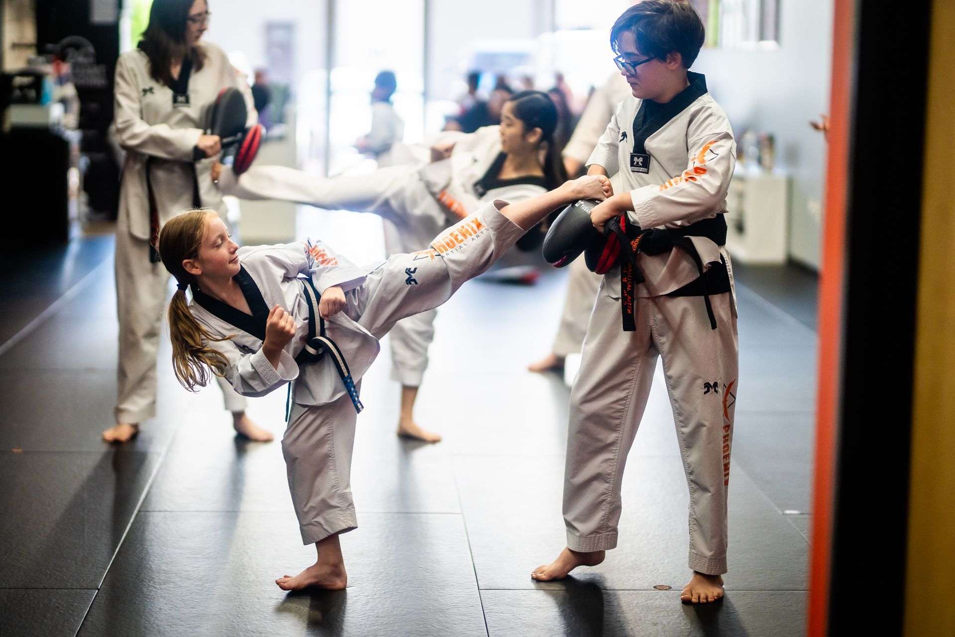 Students developing speed, accuracy, and confidence with pad drills at Phoenix Martial Arts in Murfreesboro, TN