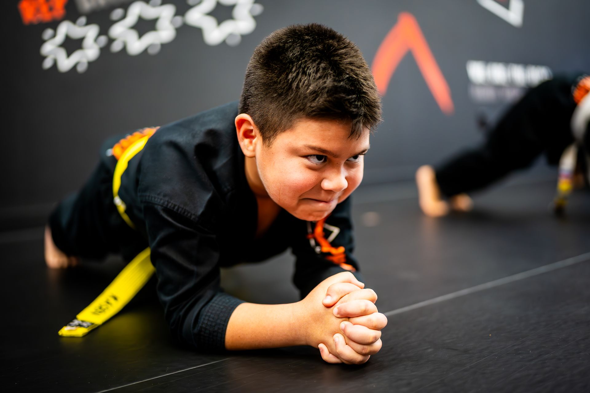 Kids developing core strength and discipline during martial arts conditioning at Phoenix Martial Arts in Murfreesboro, TN