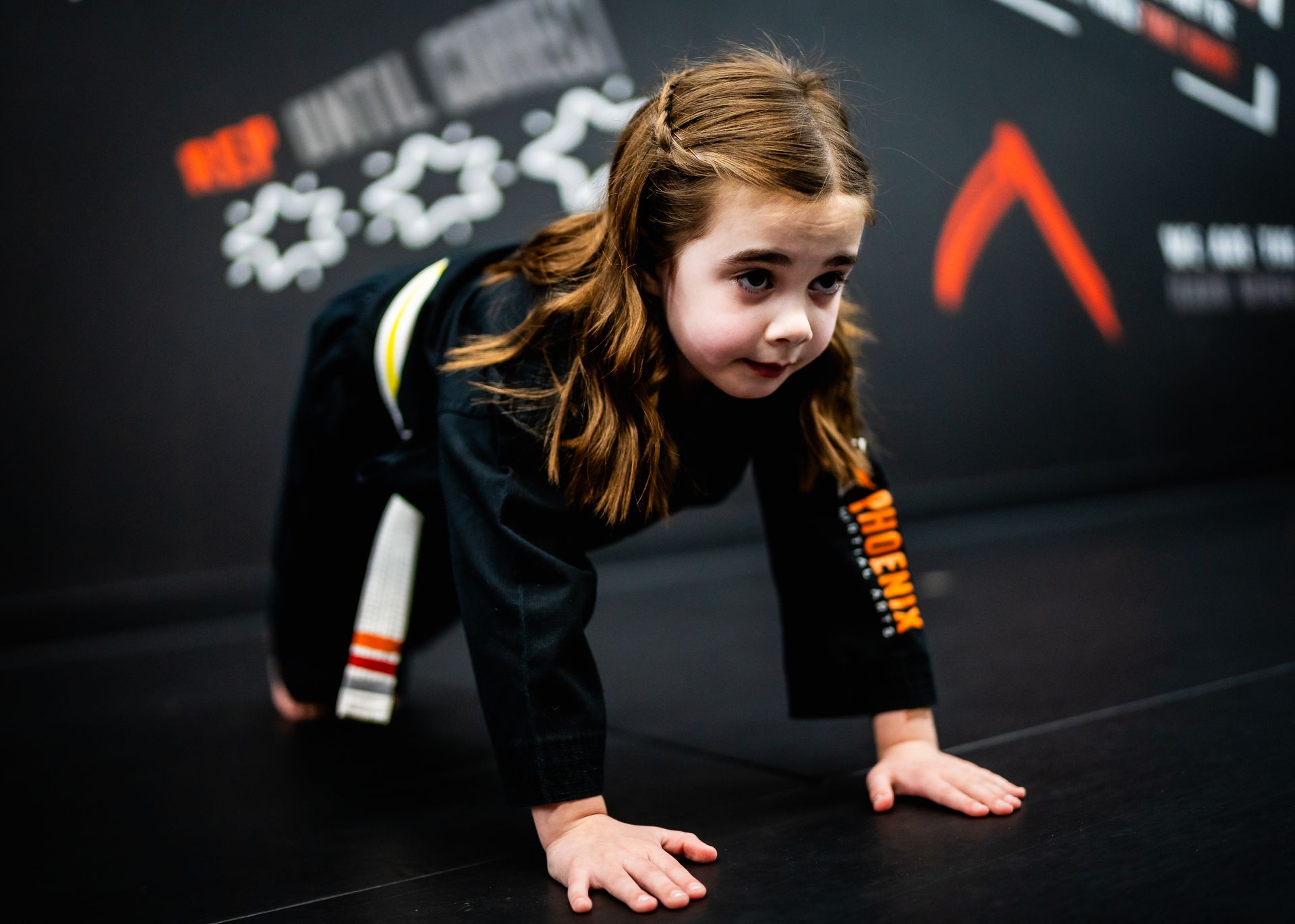 Young student improving strength and perseverance during kids martial arts class at Phoenix Martial Arts in Murfreesboro, TN