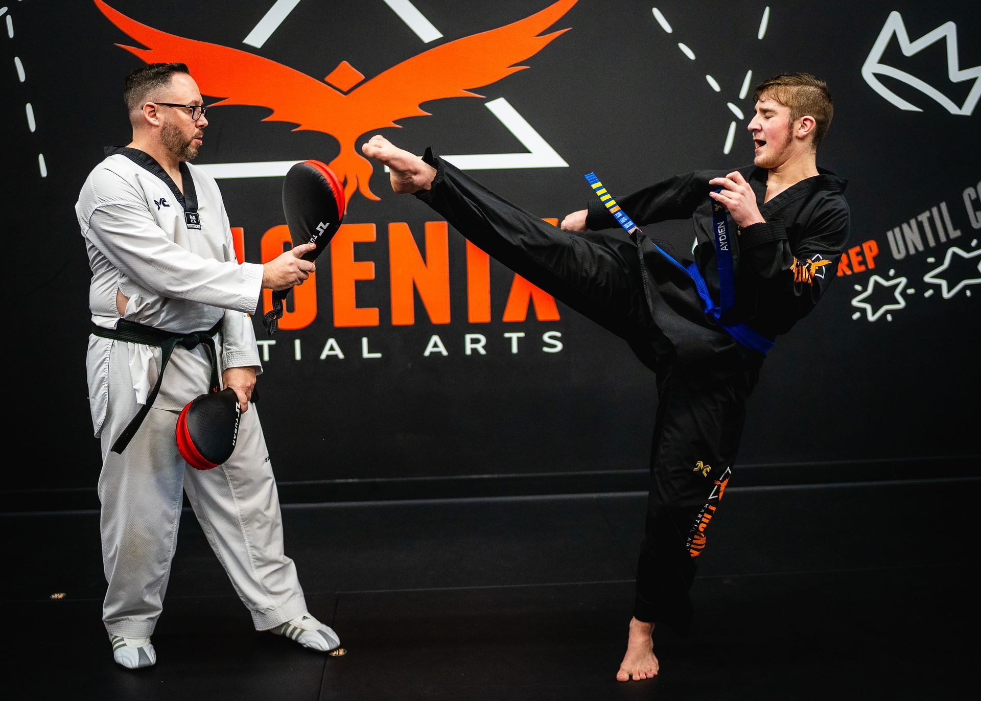 Teen student practicing powerful kicking drills during martial arts training at Phoenix Martial Arts in Murfreesboro, TN
