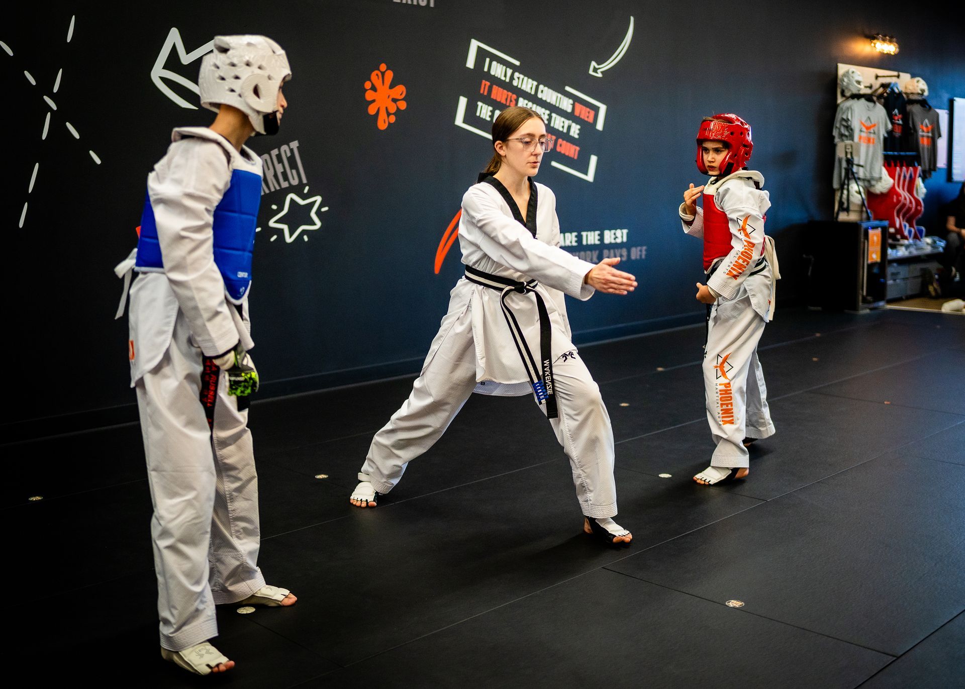 Teen students developing confidence and sportsmanship during Taekwondo sparring at Phoenix Martial Arts in Murfreesboro, TN