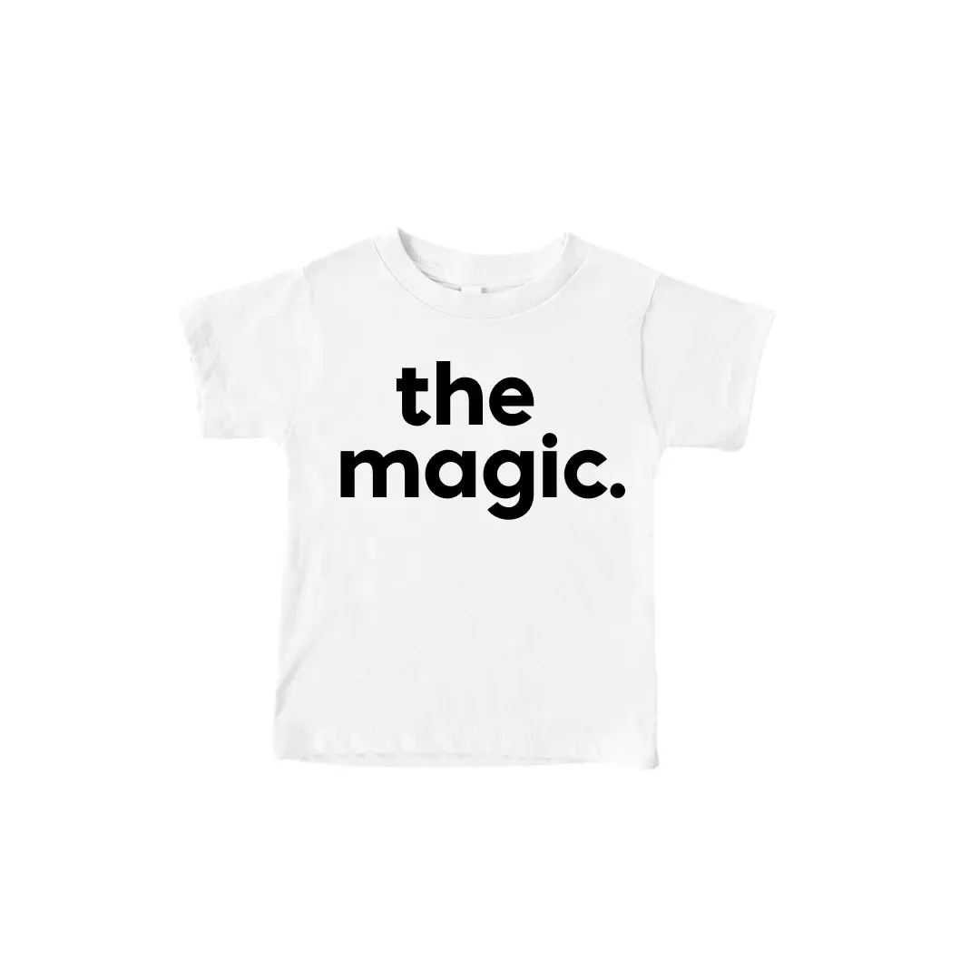 a white t-shirt with the words `` the magic '' on it .