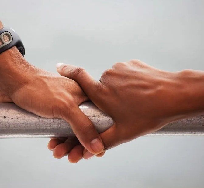 Black couple holding hands expressing their Black love