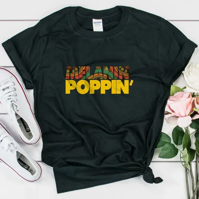 a black t-shirt with the words melanin poppin ' on it