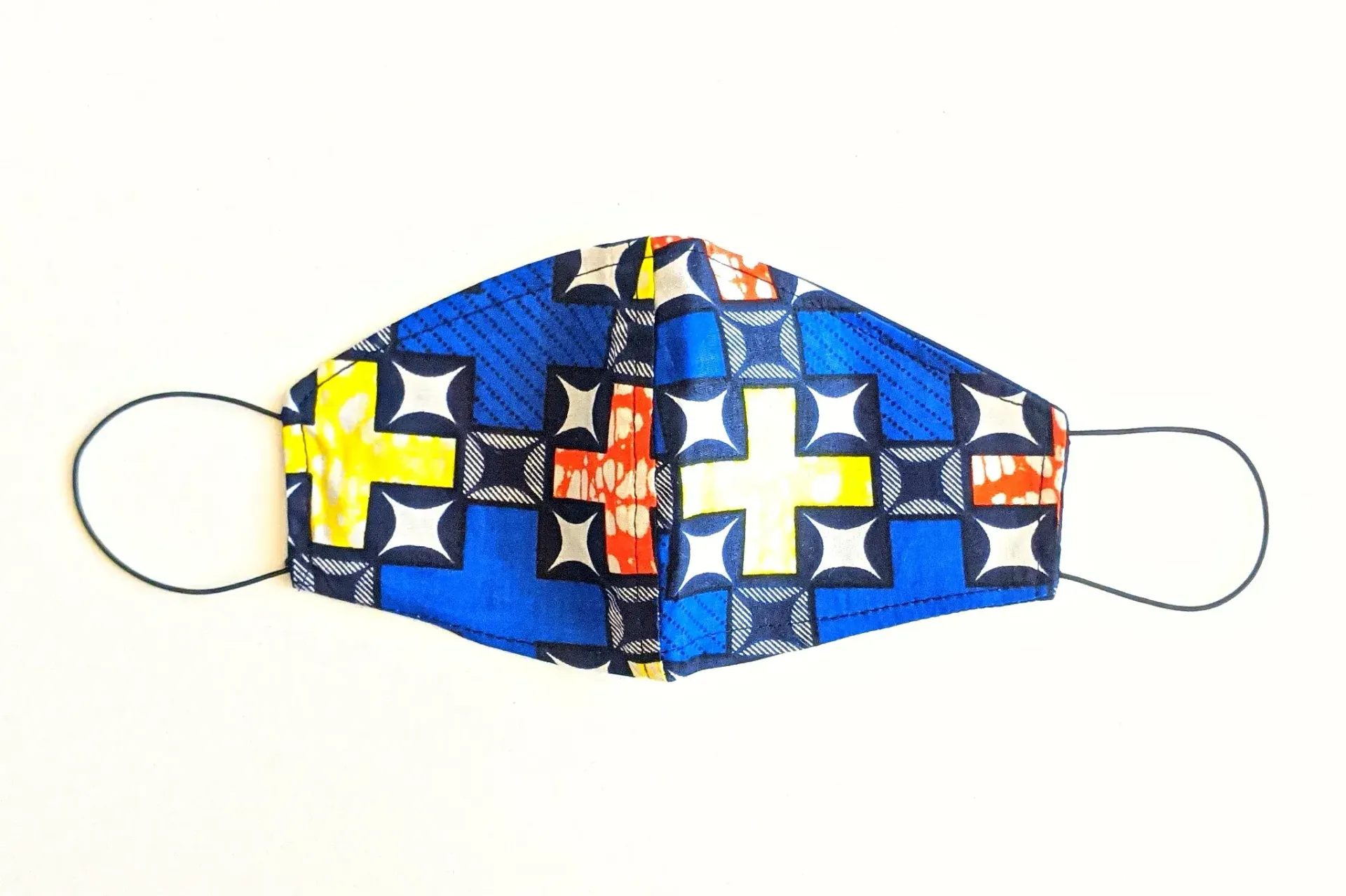 a blue and yellow face mask with a cross on it