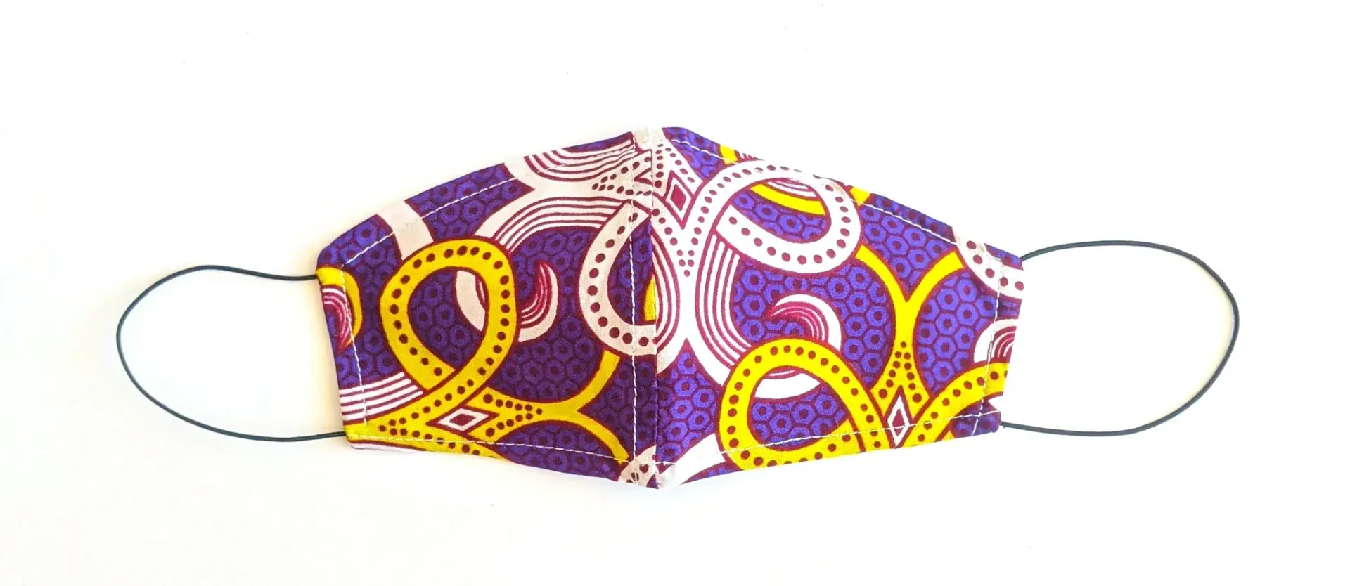 a face mask with a purple and yellow pattern on it