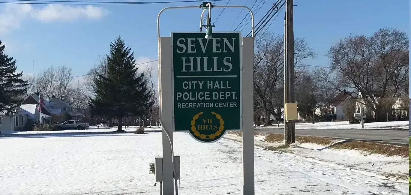 Snowy entrance sign for Seven Hills City Hall and Police Dept.