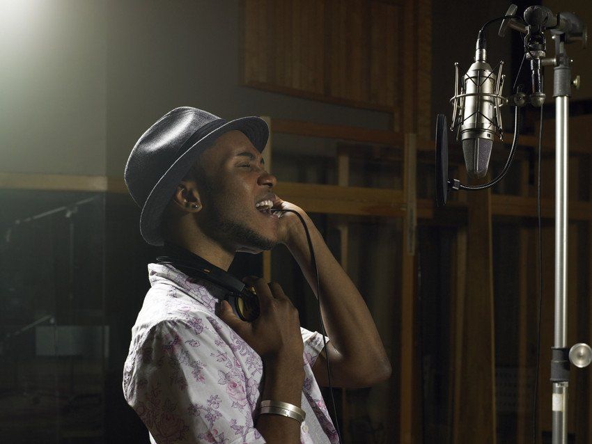 man singing with earphones