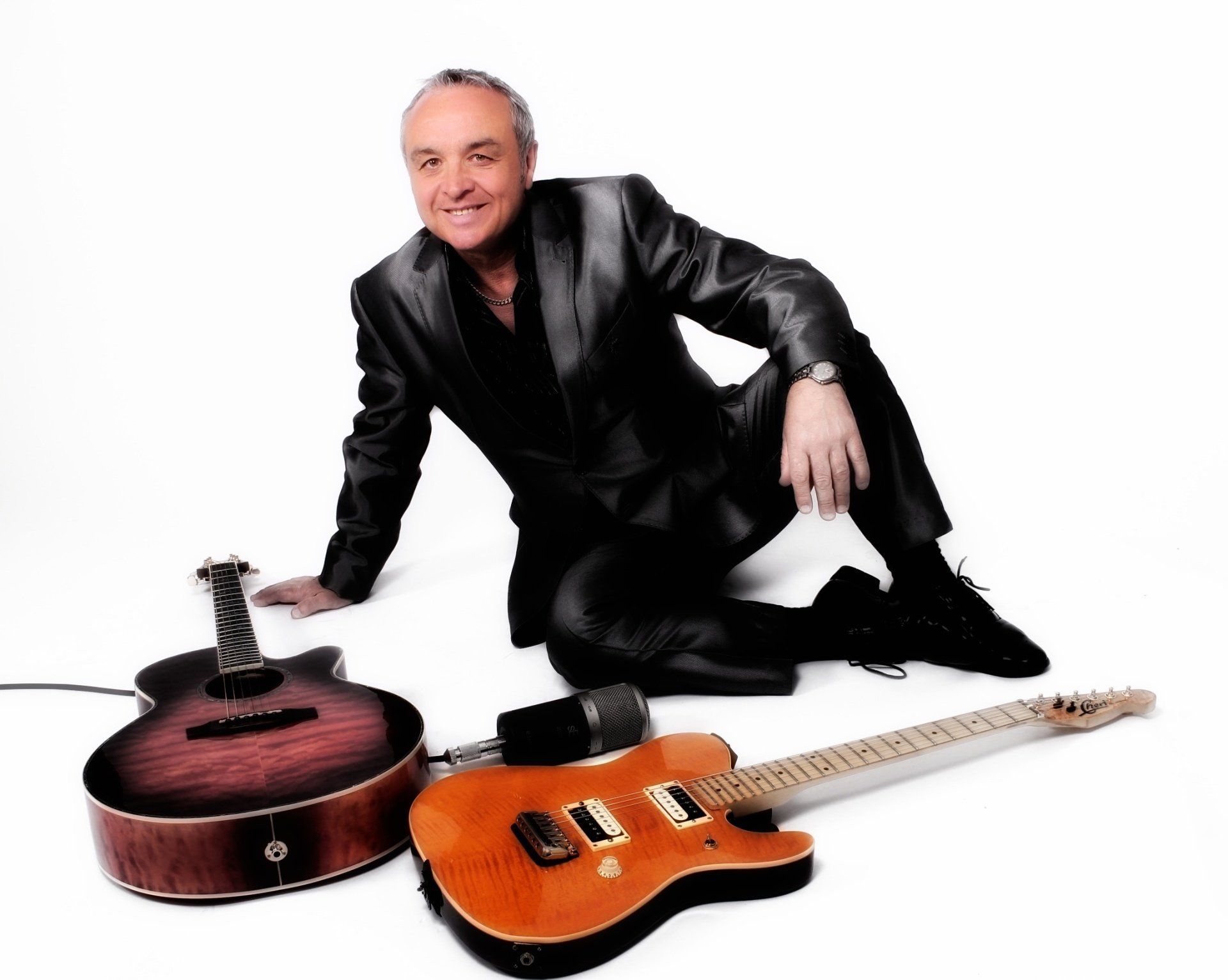 man in blue shirt singing