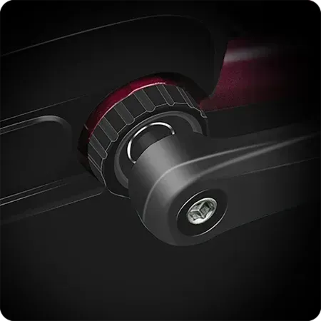 Close-up of a black camera mount knob with red accent and silver screw detail