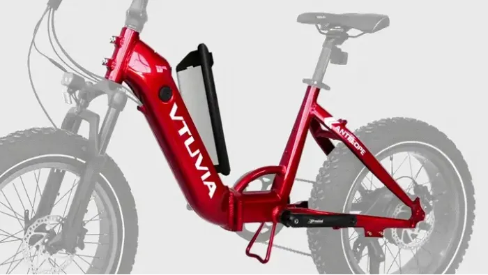 Red folding electric bike with step-through frame and compact wheels on a white background