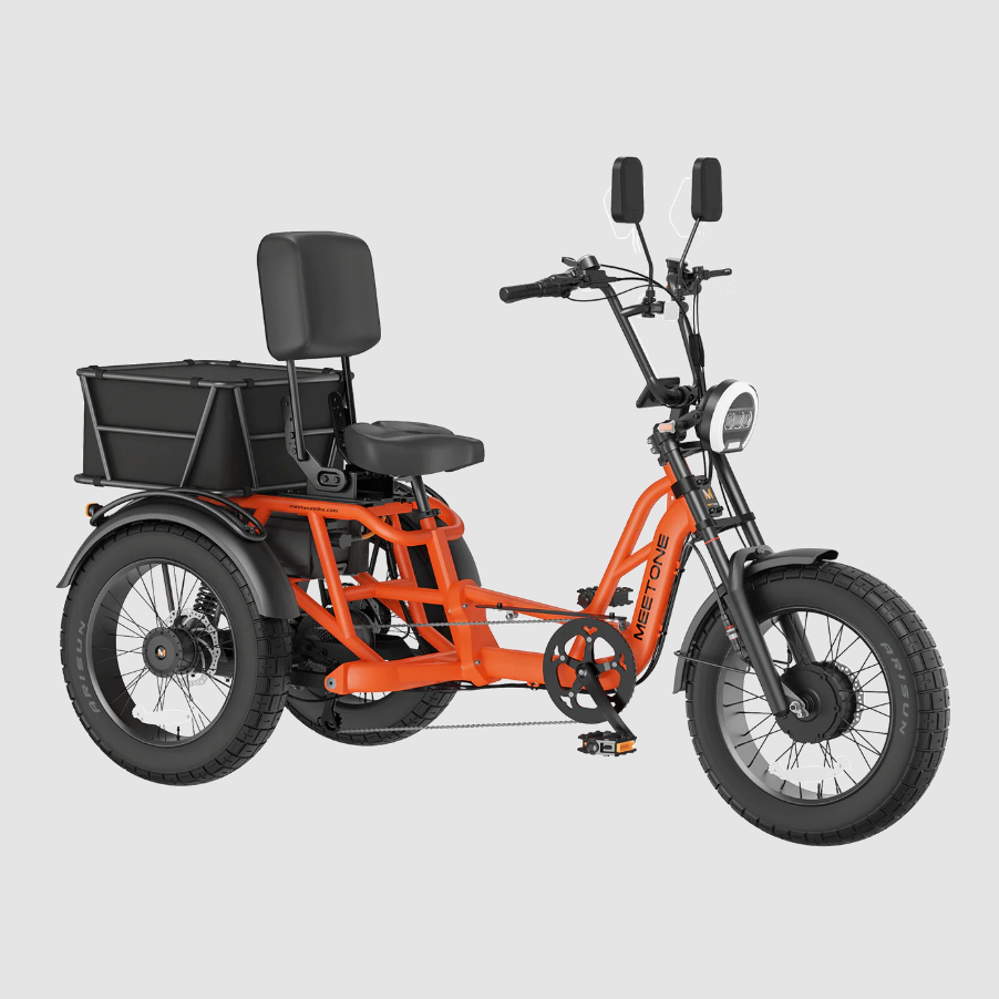 Orange electric tricycle with black seat, handlebars, rear cargo basket, and rear passenger backrest on a gray background
