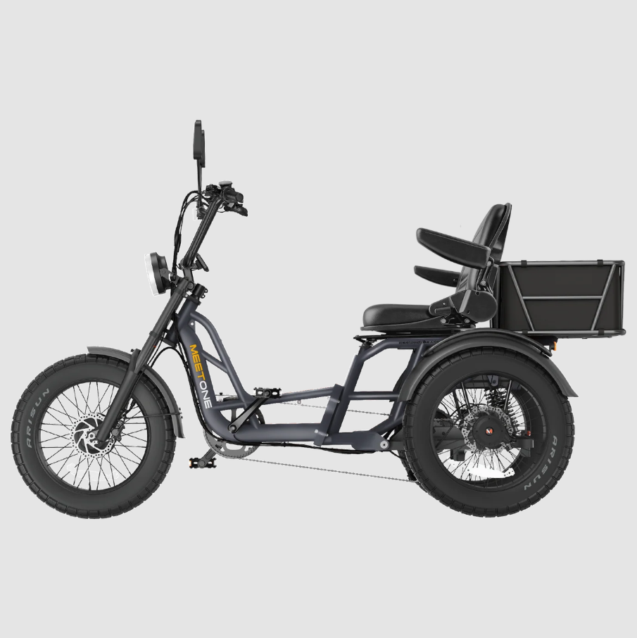 Black electric tricycle with front handlebars, rear seat, and cargo box on a plain background