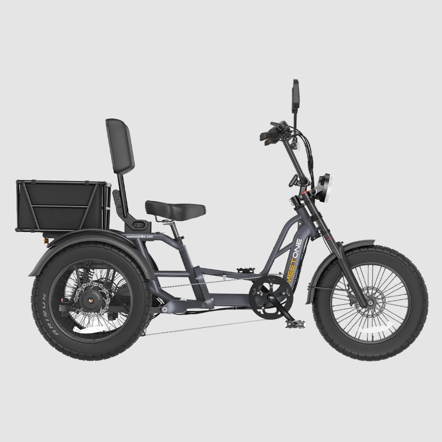Black three-wheeled cargo tricycle with a rear basket and padded seat on a plain background