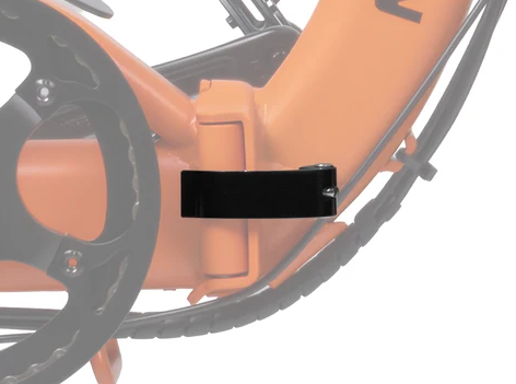 Close-up of an orange bicycle frame with a black component near the bottom bracket.