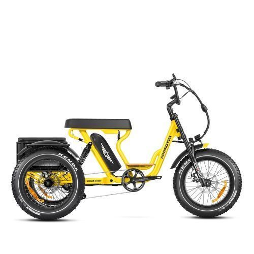 Yellow electric cargo tricycle with black seat and fat tires on a white background