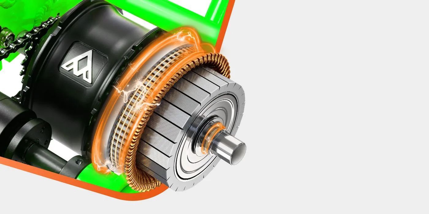 Close-up of an electric motor rotor with copper windings and a black housing on a white background