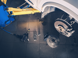 A car is being worked on in a garage