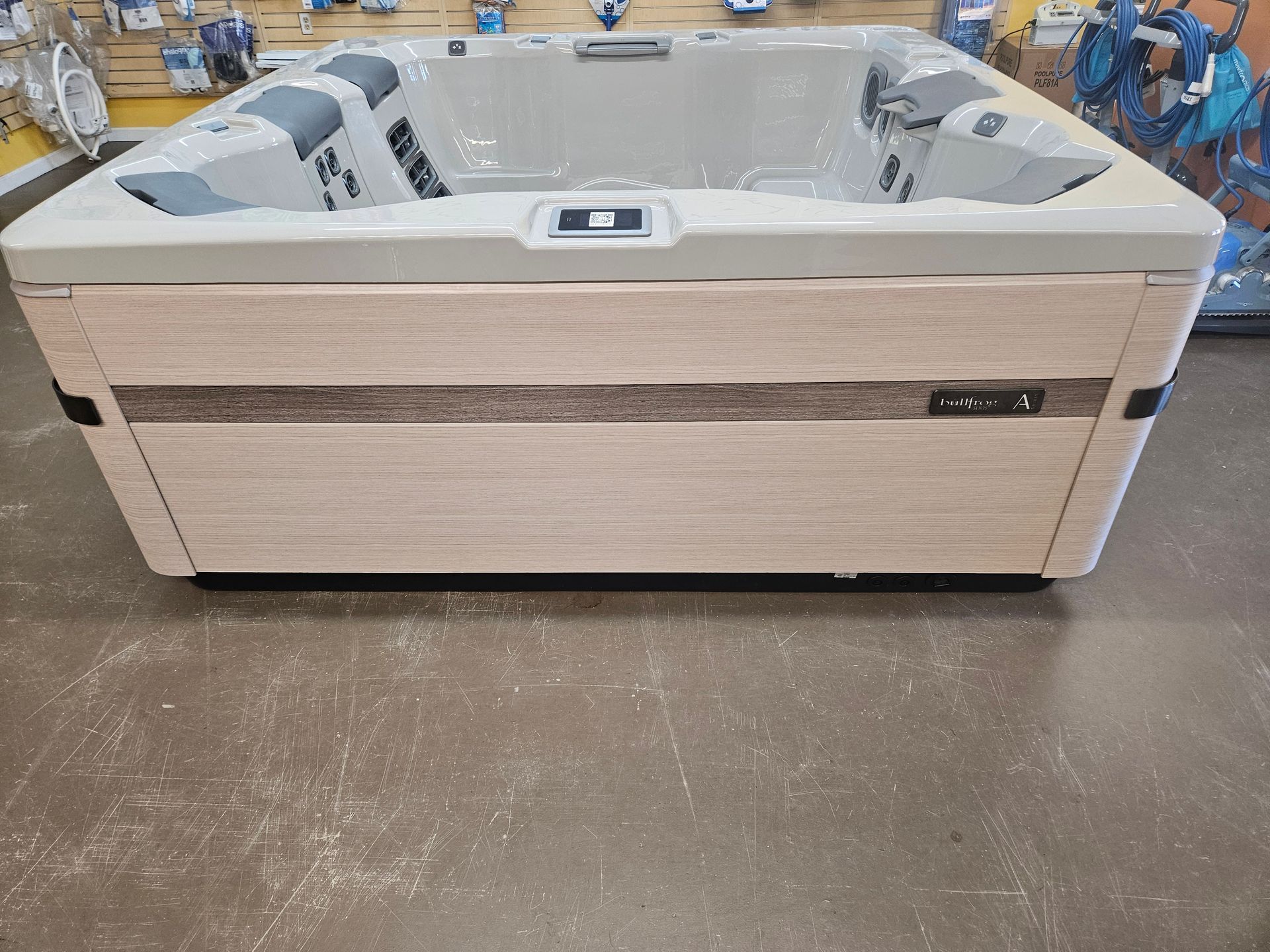 A hot tub is sitting on a table in a store.