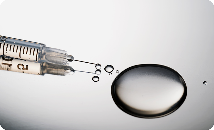 Syringe and cell droplet representing IV stem cell wellness therapy in Korea