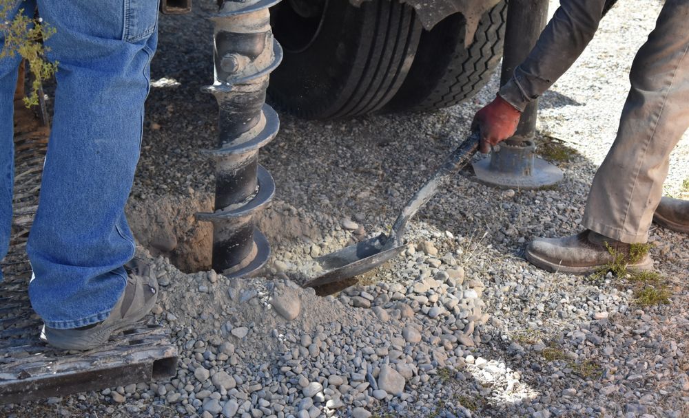 Workers Using an Auger to Drill a Hole Into Gravel, Near a Truck — ALI Civil Pty Ltd in South in Jervis Bay, NSW