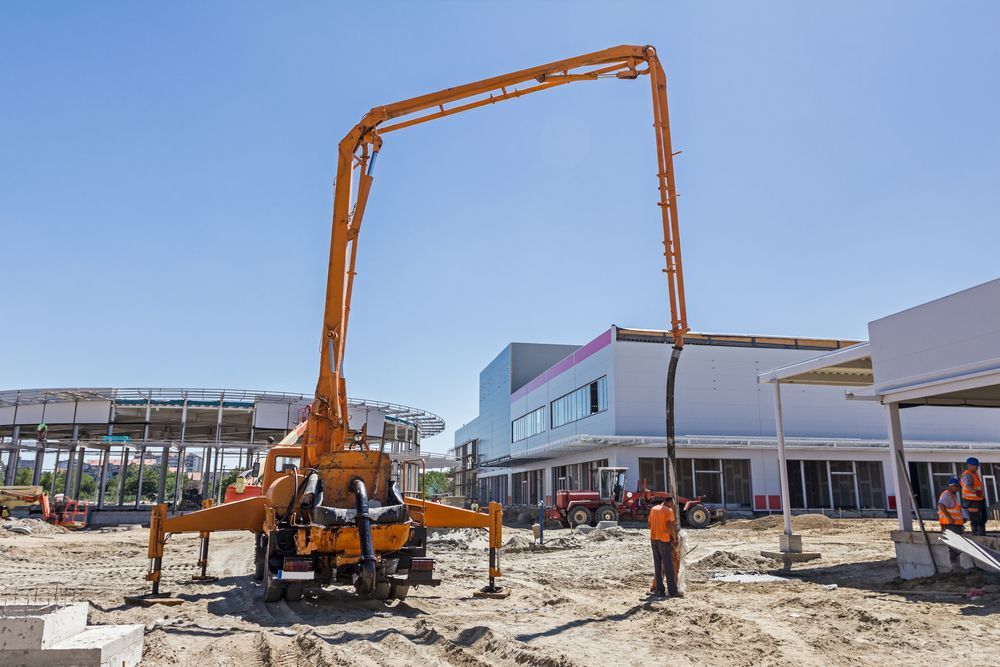 Concrete Pump Truck Pouring Concrete on a Construction Site — ALI Civil Pty Ltd in Shellharbour, NSW