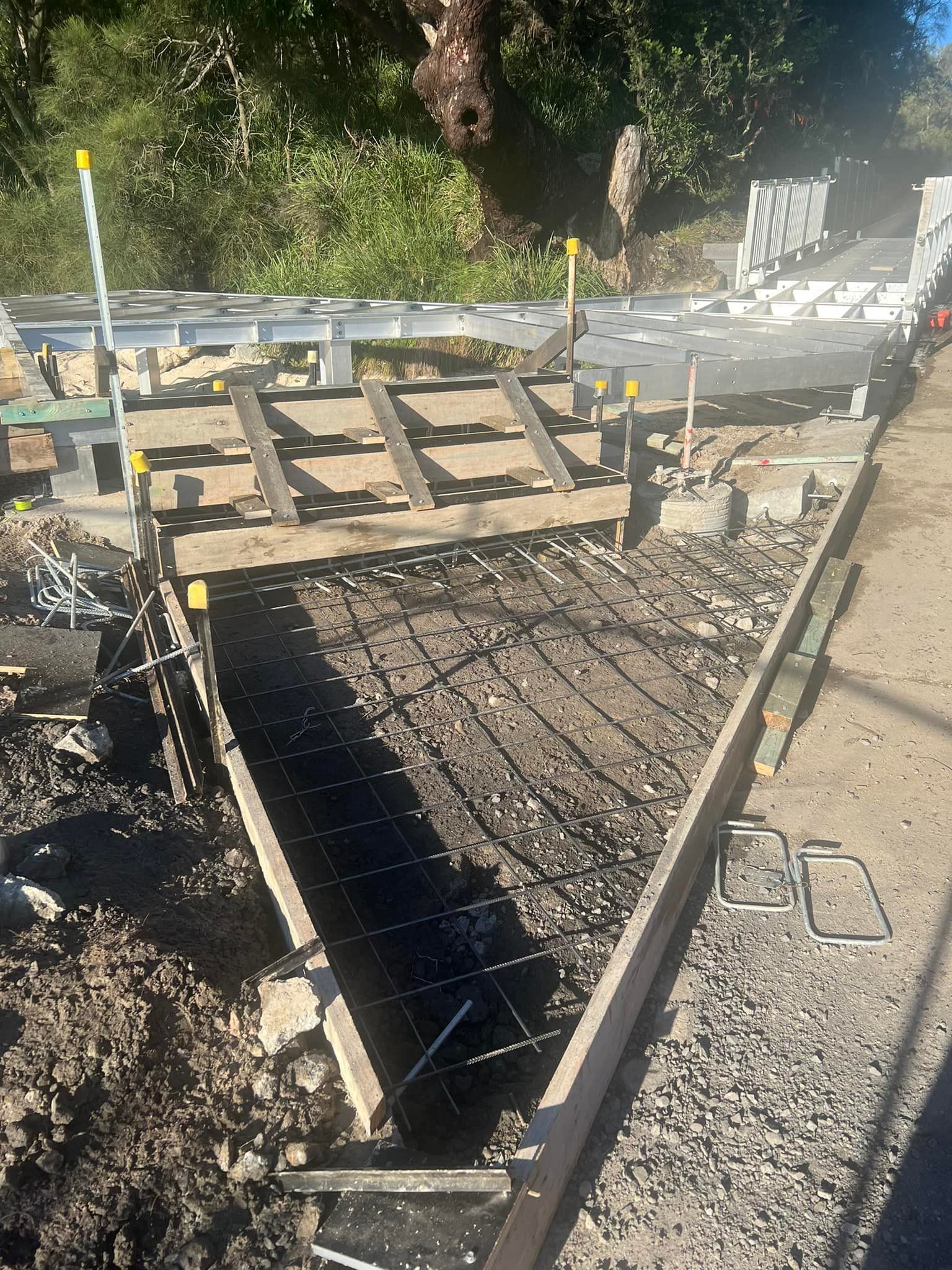 Construction Site Concrete Formwork With Rebar, Wood, Metal, and Gravel — ALI Civil Pty Ltd in Sussex Inlet, NSW