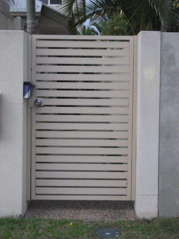 A White Fence With A Aluminium Gate And A Mailbox In Front Of It — AAA Fencing & Supplies in Southport, QLD