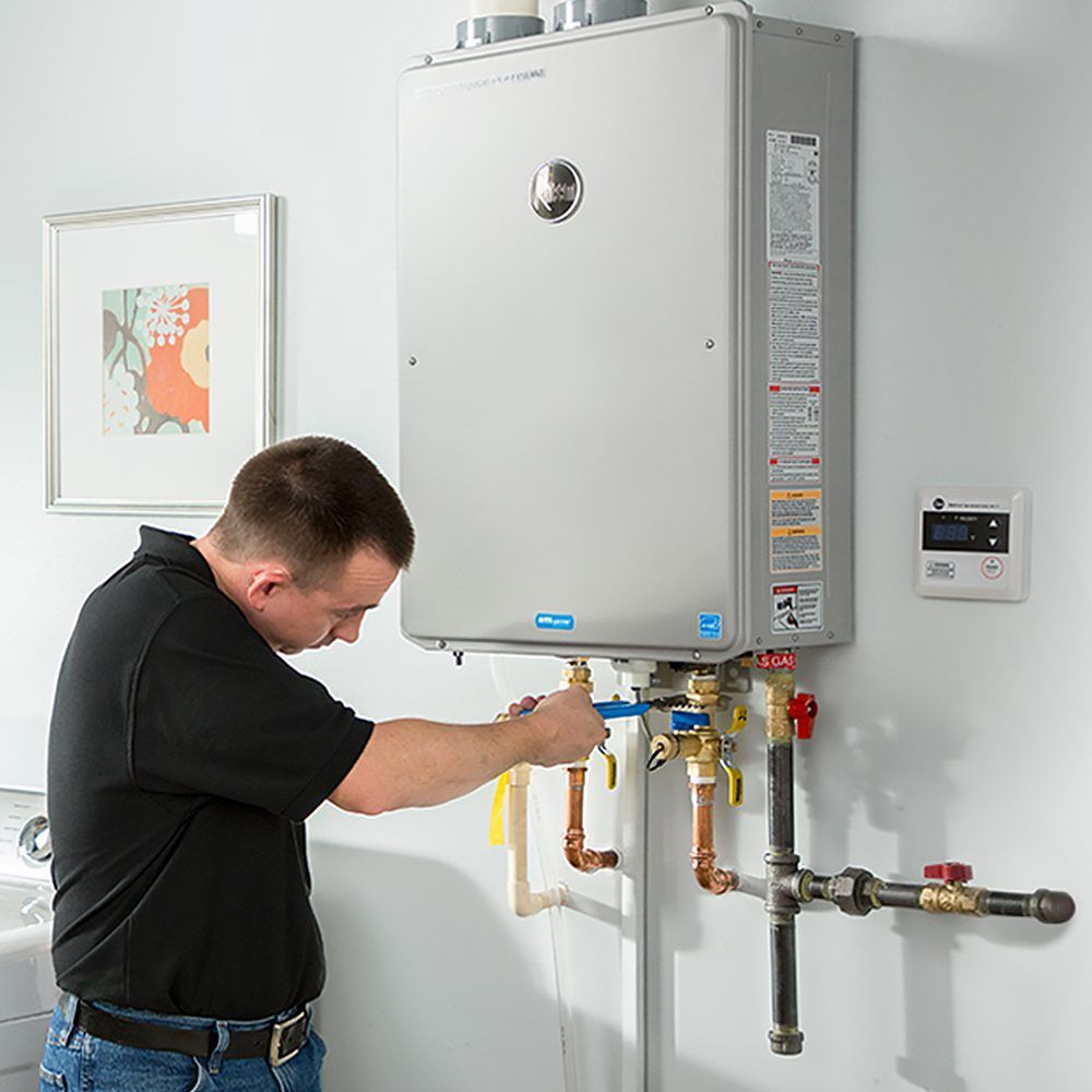 Plumber Today technician installing a gas tankless water heater