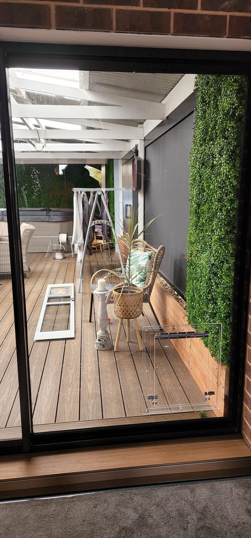 A sliding glass door is being installed in a house.