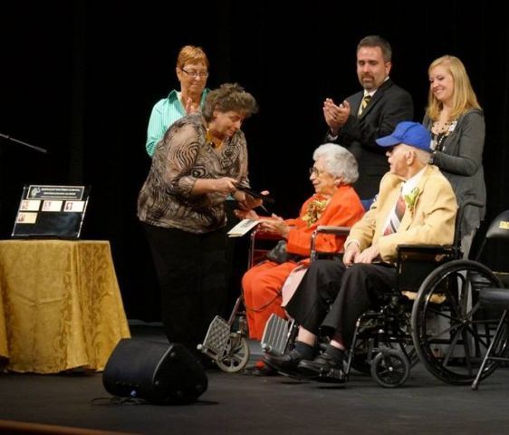A group of people in wheelchairs on a stage