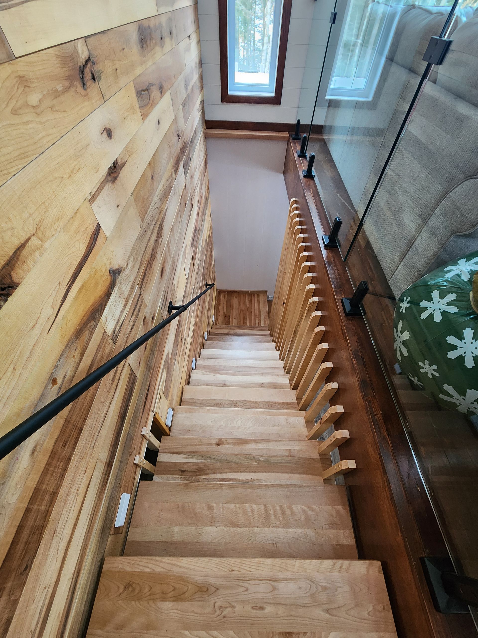 A wooden staircase leading up to the second floor of a house.